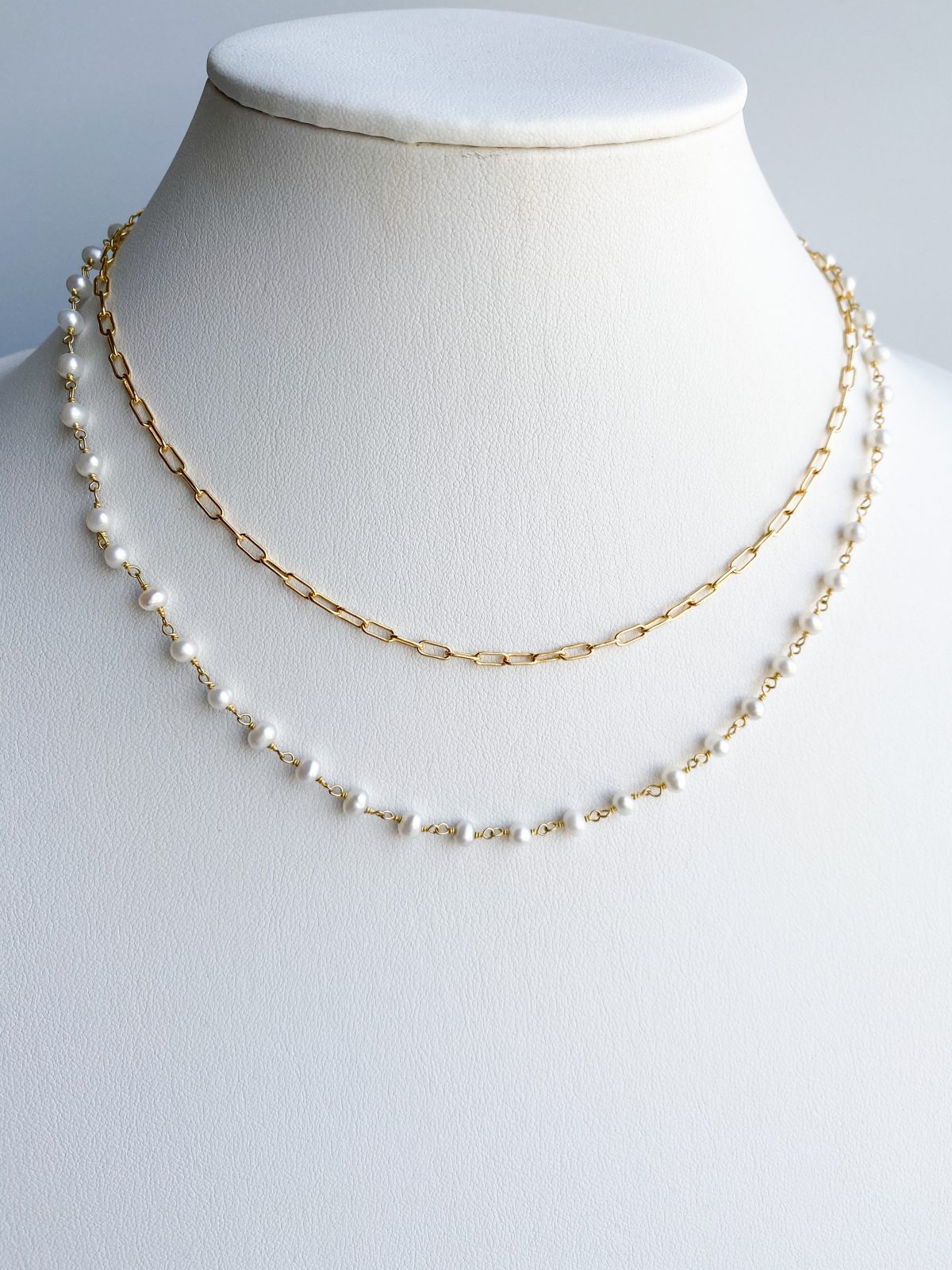 Gold and pearl double chain necklace